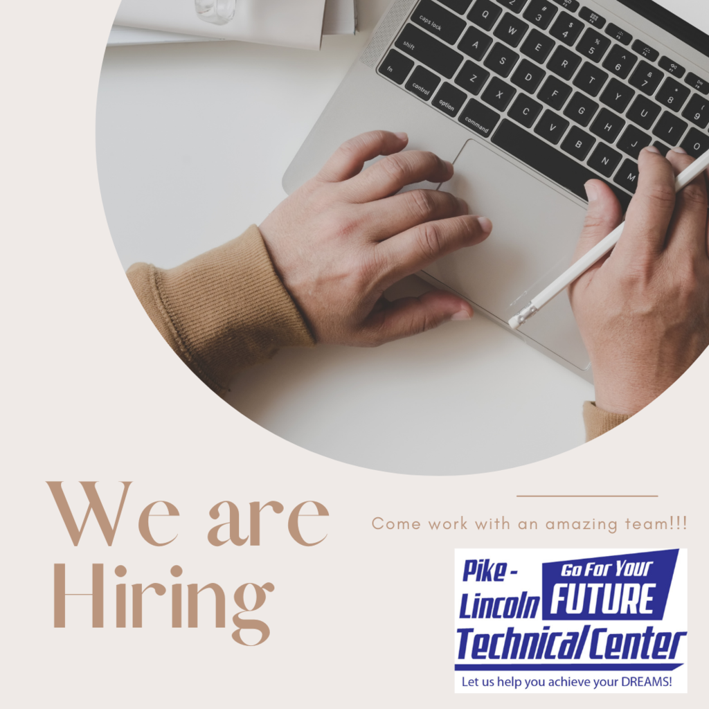 Hand on a laptop with "We Are Hiring"