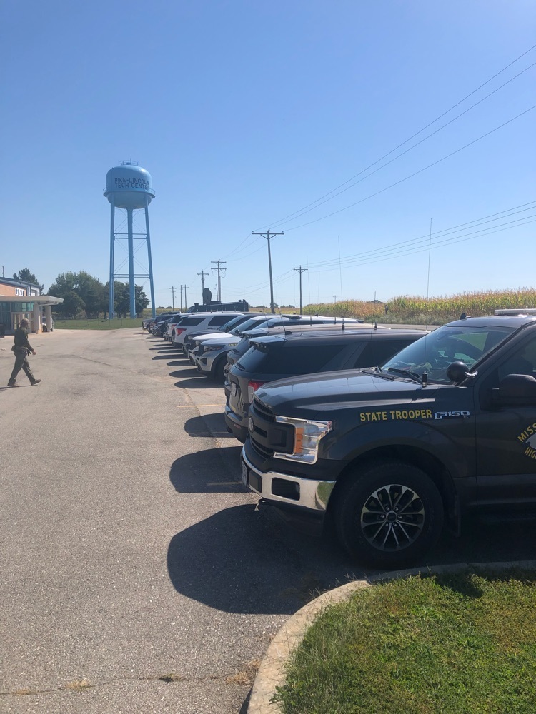 line of highway patrol vehicles